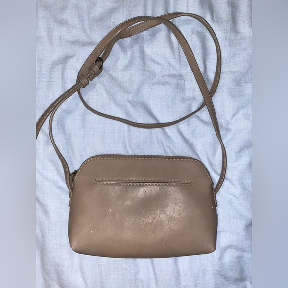 Small tan colored crossbody purse. - Picture 2 of 4